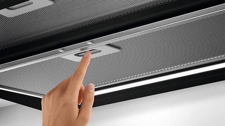 Hand removing cooking hood filter